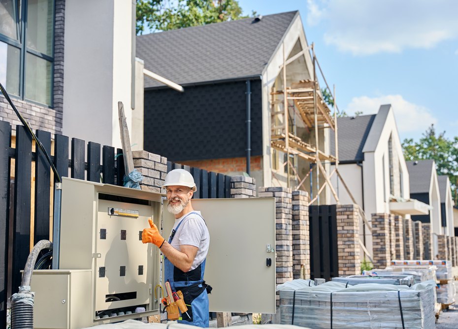 A contractor loading heating and cooling equipment